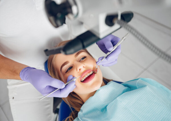 Beautiful lady in the dentist's office. Woman in a uniform